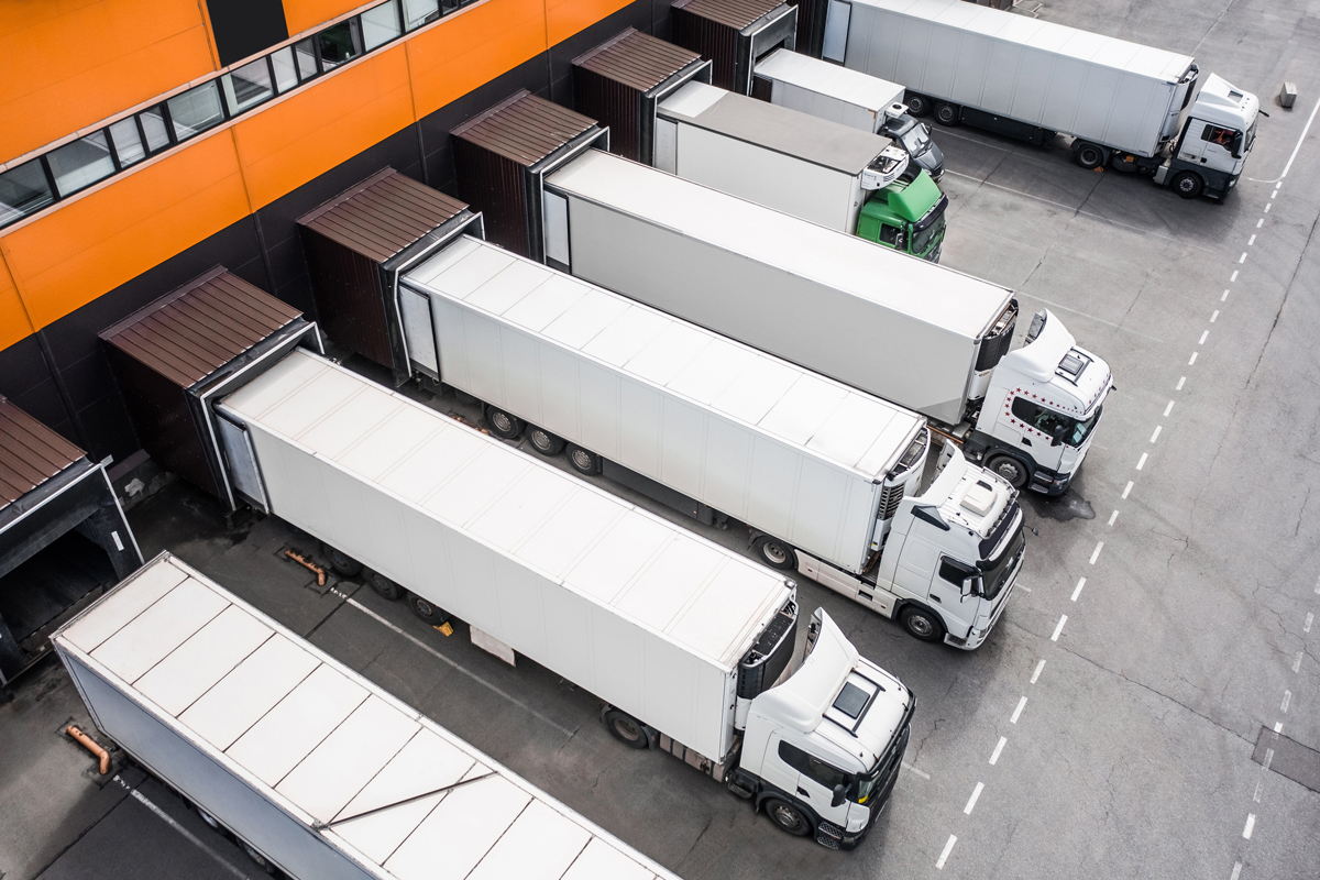 Distribution logistics — trucks lined up at the warehouse